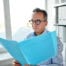 business man looking at bookkeeping record